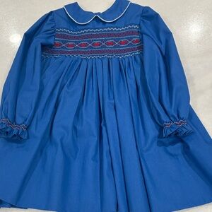 Elegant Blue Dress with Red Smocking